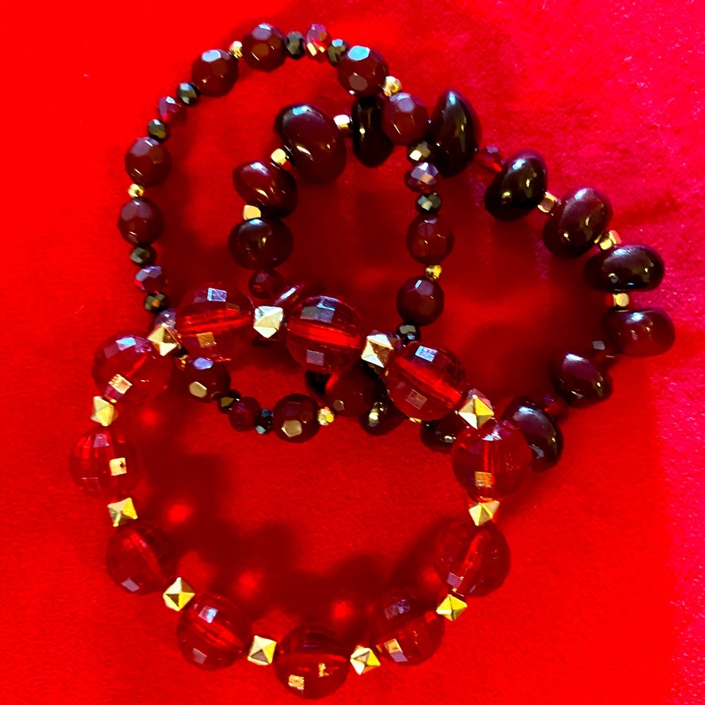 3 red jeweled bracelets